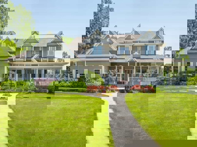 Clean residential home exterior with spring landscaping