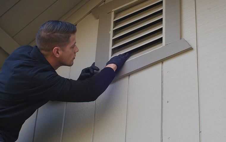 tech checking a vent