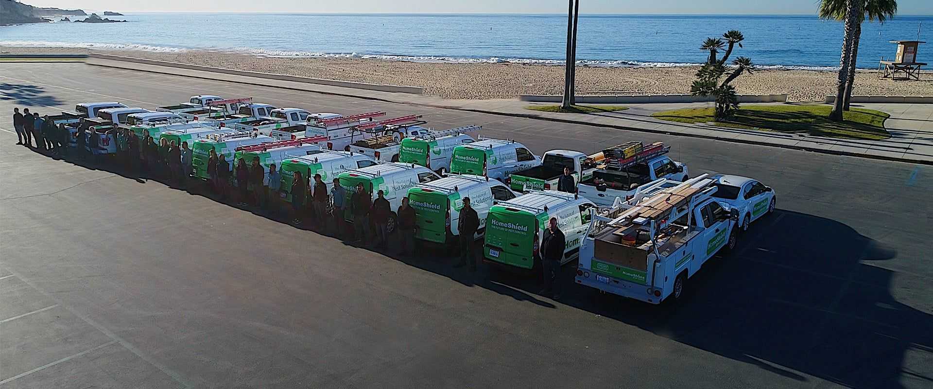 homeshield company trucks near the beach