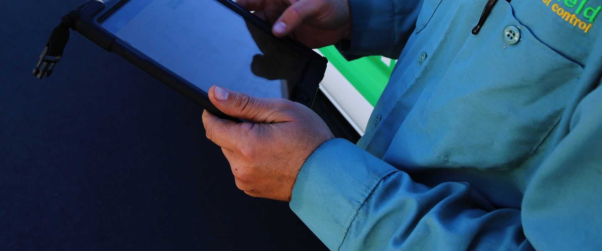 tech holding a tablet